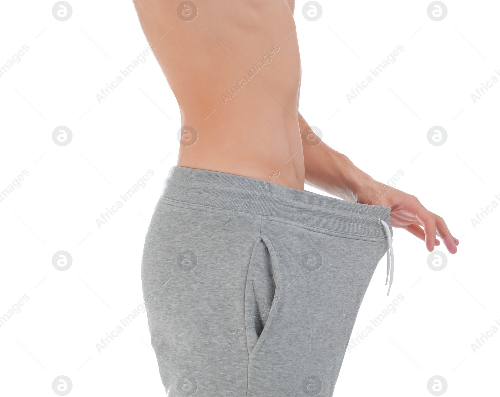 Photo of Man with urological problems on white background, closeup
