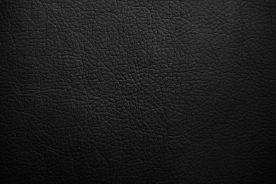 Texture of black leather as background, closeup