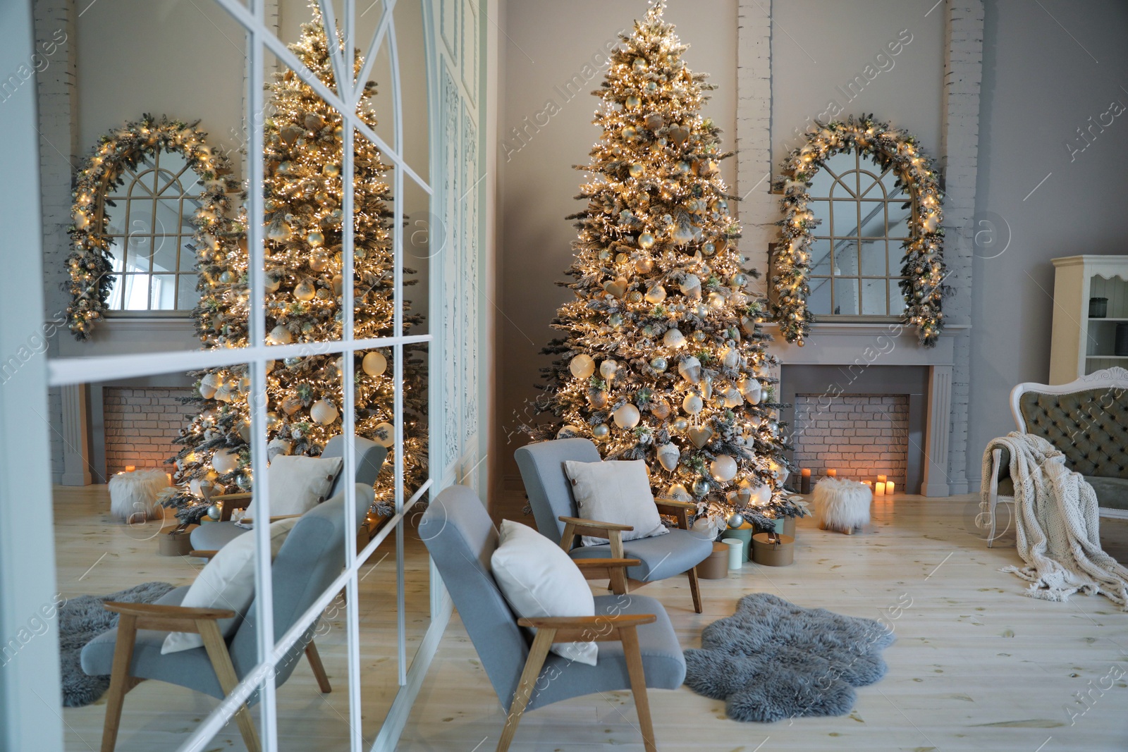 Photo of Festive room interior with stylish furniture and beautiful Christmas tree