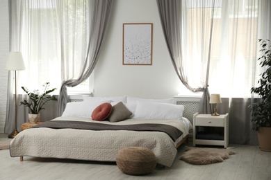 Photo of Stylish modern bedroom with decorative elements. Idea for interior design