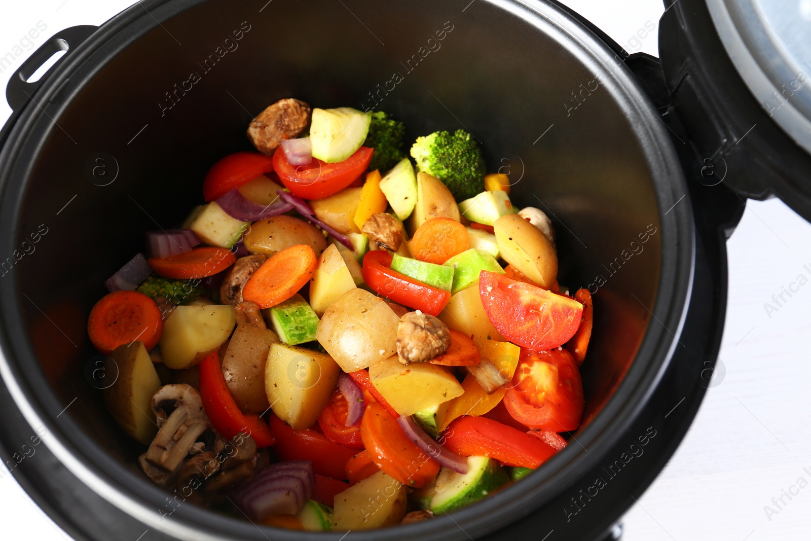 Photo of Closeup view of multi cooker with vegetables