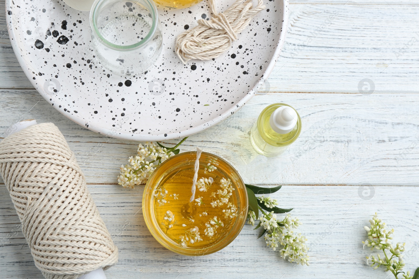 Photo of Flat lay composition with candle on wooden background