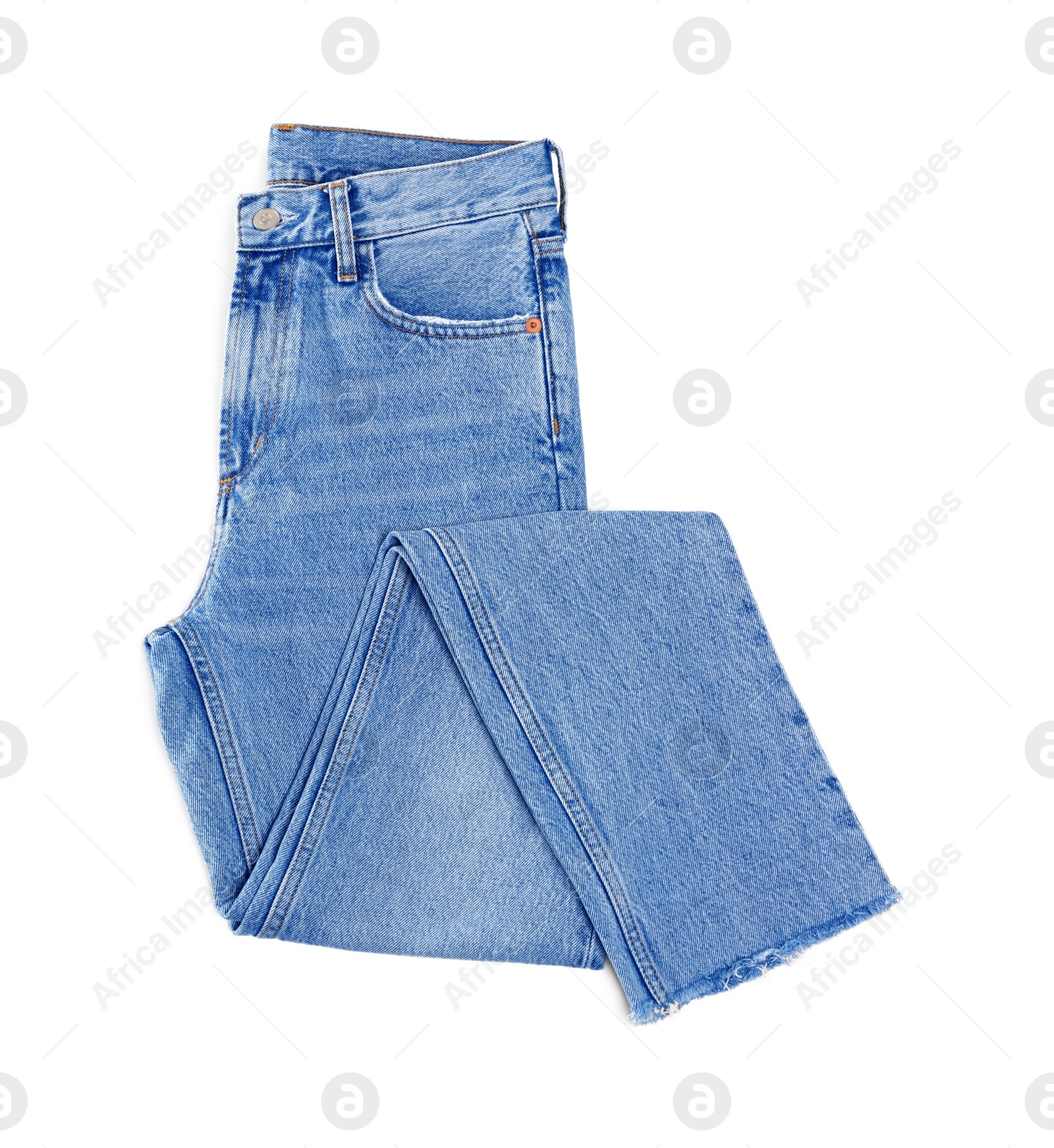 Photo of Light blue jeans isolated on white, top view. Stylish clothes