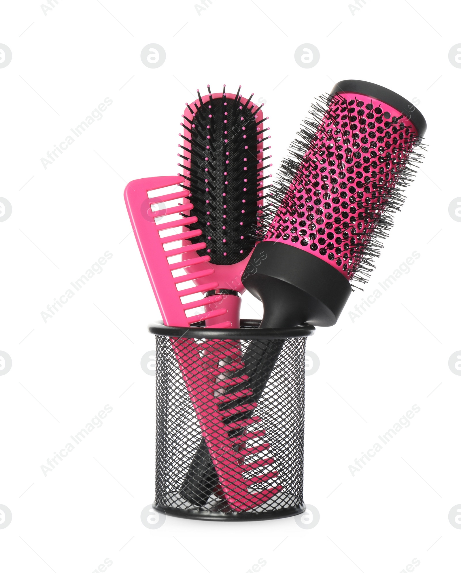 Photo of Hairbrushes and comb in holder on white background