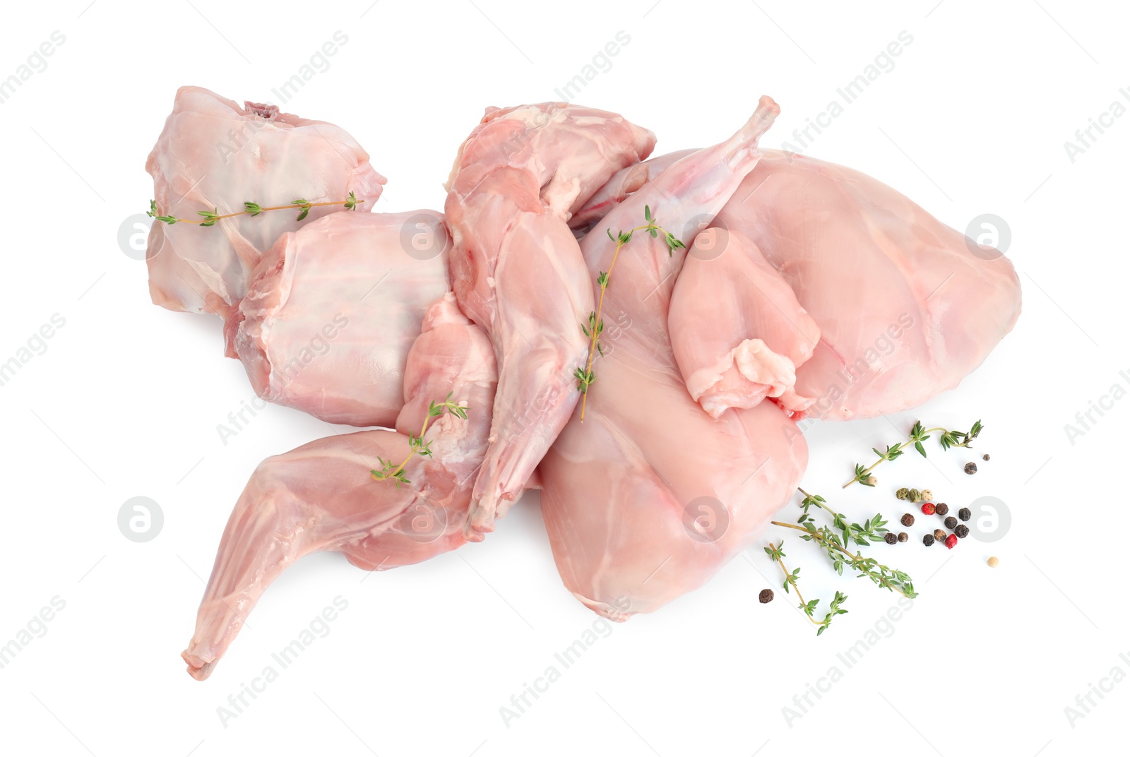 Photo of Fresh raw rabbit meat and spices isolated on white, top view