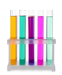 Photo of Many test tubes with colorful liquids in stand on white background