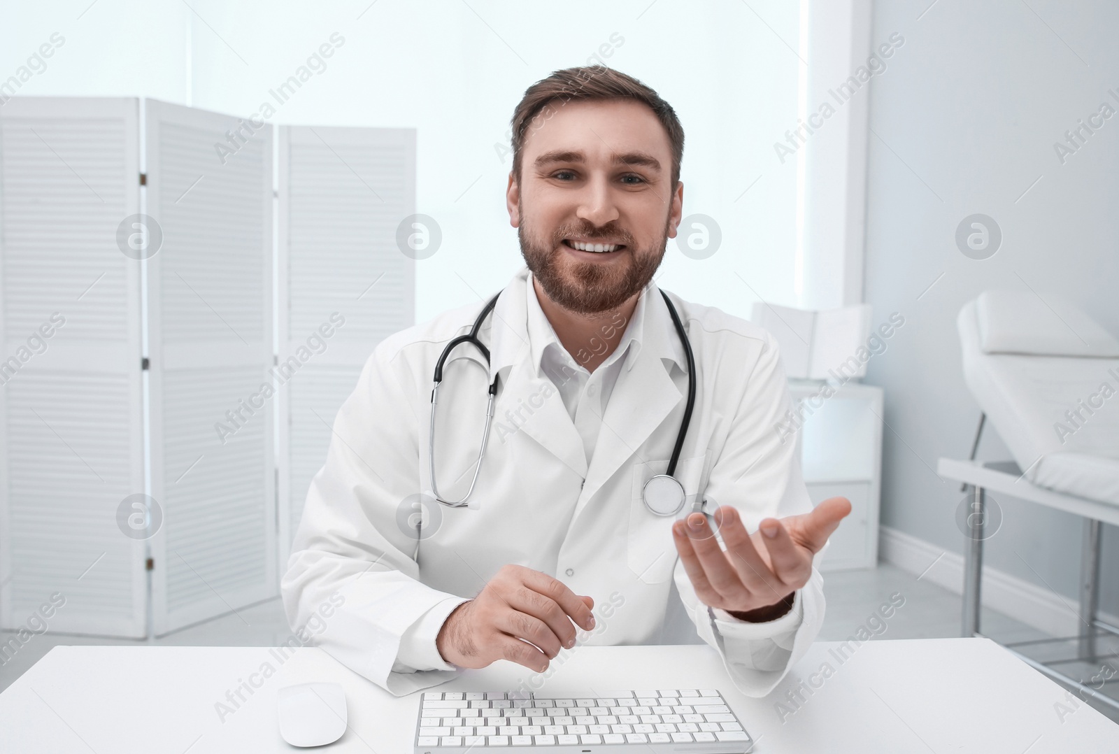 Photo of Pediatrician consulting patient using video chat in clinic, view from webcam