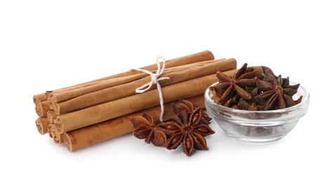Photo of Aromatic cinnamon sticks and anise isolated on white