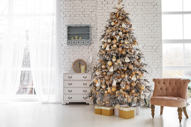 Beautiful room interior with decorated Christmas tree