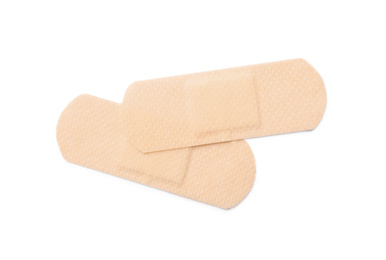 Photo of Medical sticking plasters isolated on white. First aid item