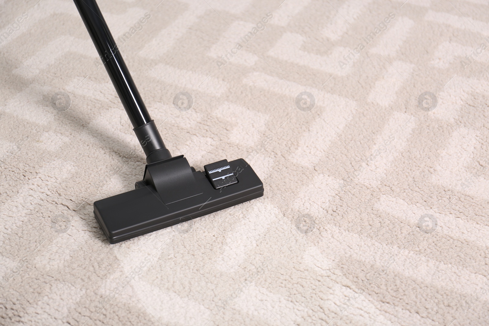 Image of Vacuuming dirty carpet. Clean area after using device, closeup