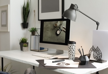 Photo of Stylish workplace with modern computer on desk