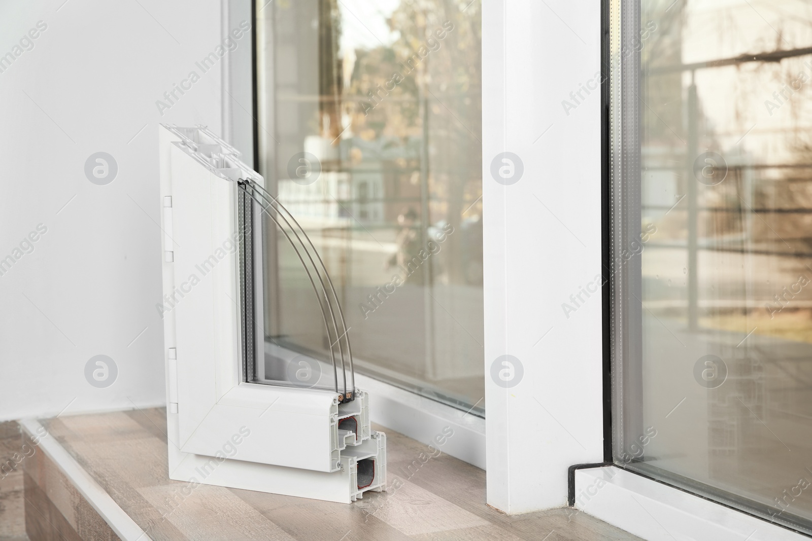 Photo of Sample of modern window profile on sill indoors, space for text. Installation service