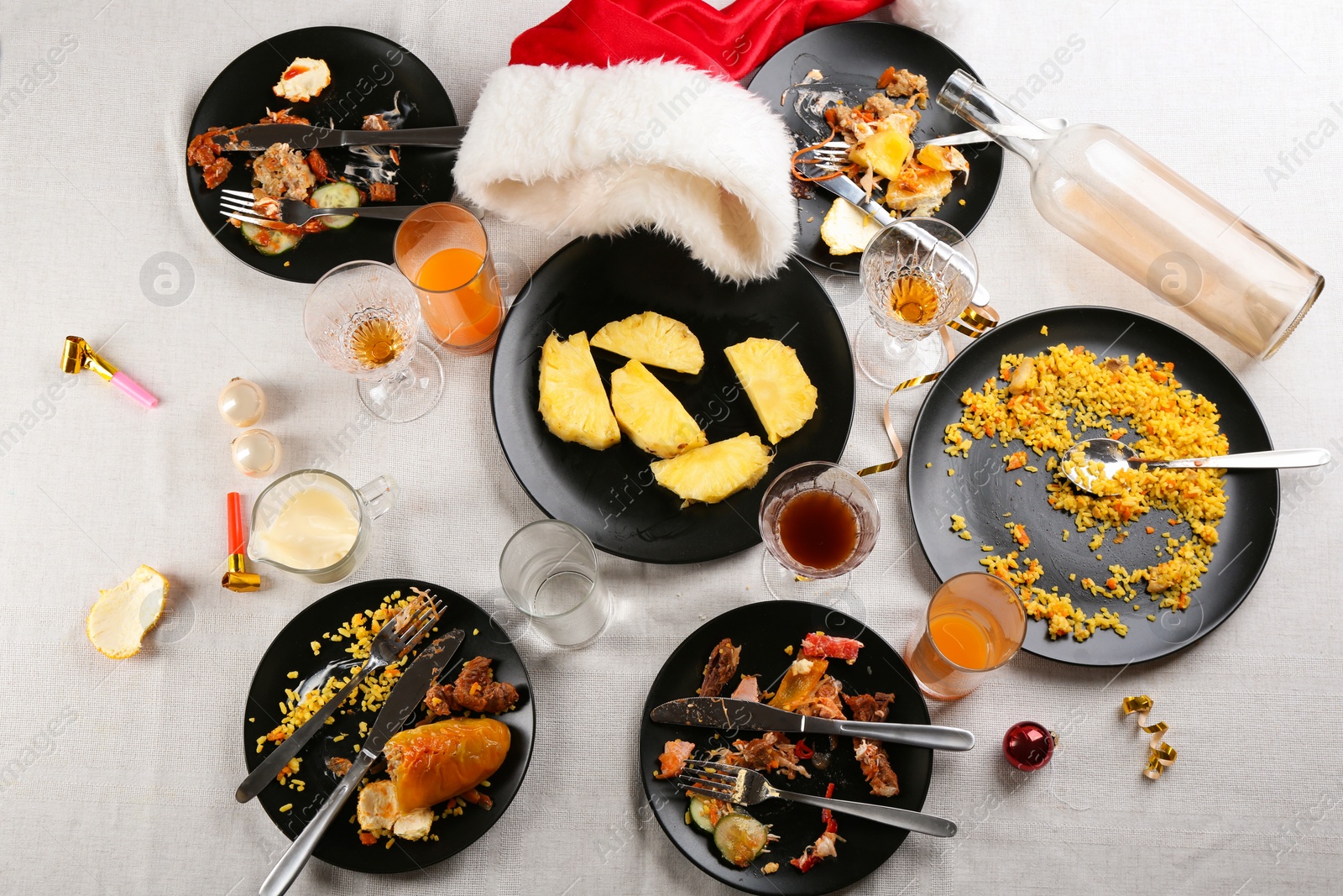 Photo of Composition with food leftovers after party on table, above view