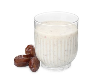 Photo of Glass of delicious smoothie and dried dates on white background