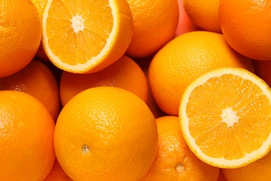 Photo of Tasty ripe fresh oranges as background, top view