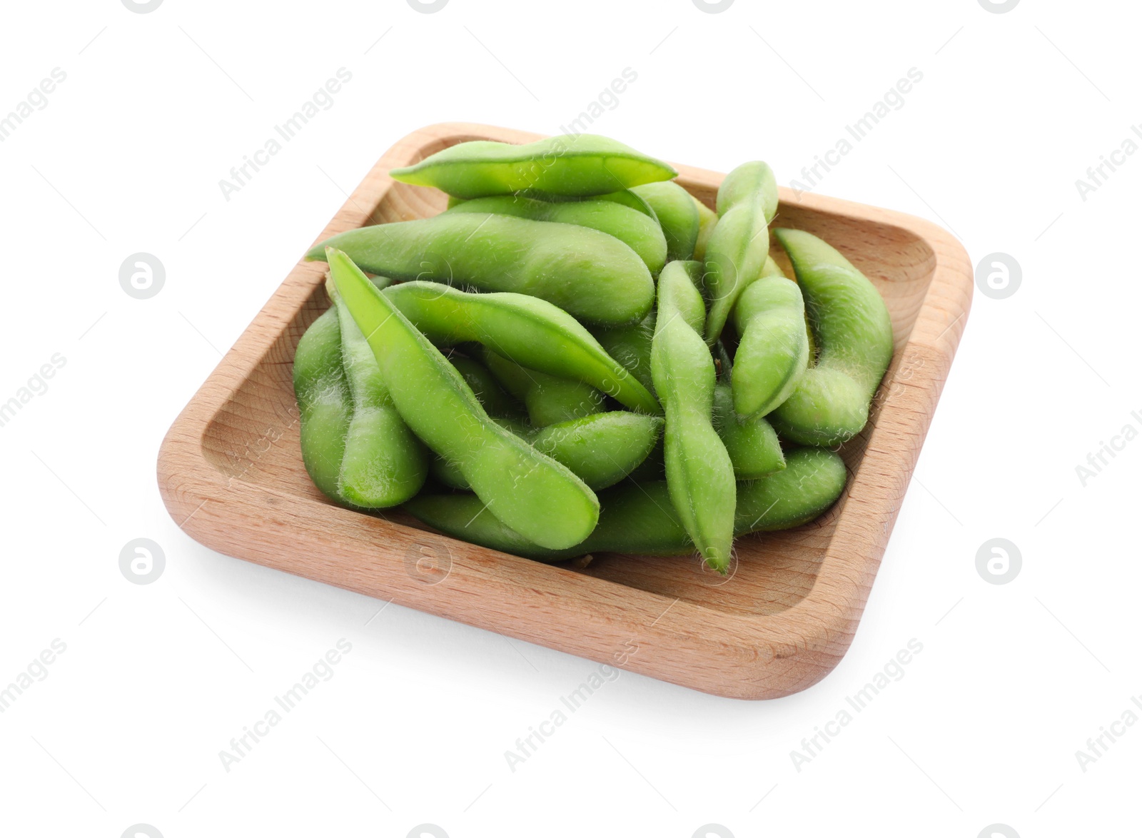 Photo of Wooden plate with green edamame pods on white background