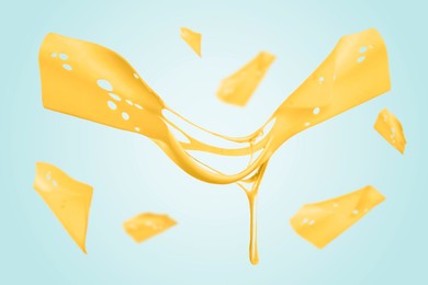 Slices of cheese falling on light blue background