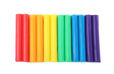 Photo of Many different colorful plasticine pieces on white background, top view