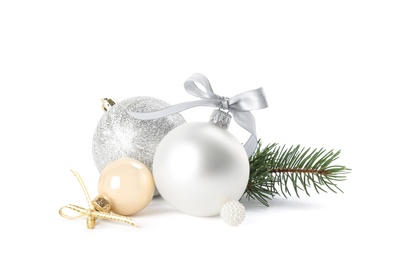 Photo of Beautiful Christmas balls and fir branch on white background
