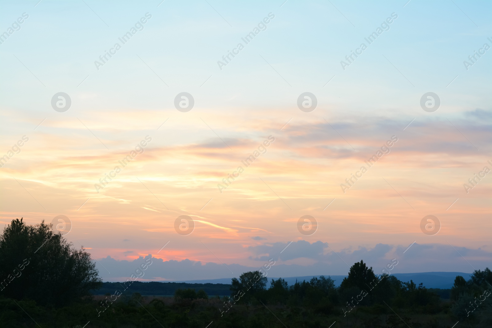 Photo of Picturesque view of beautiful countryside at sunset