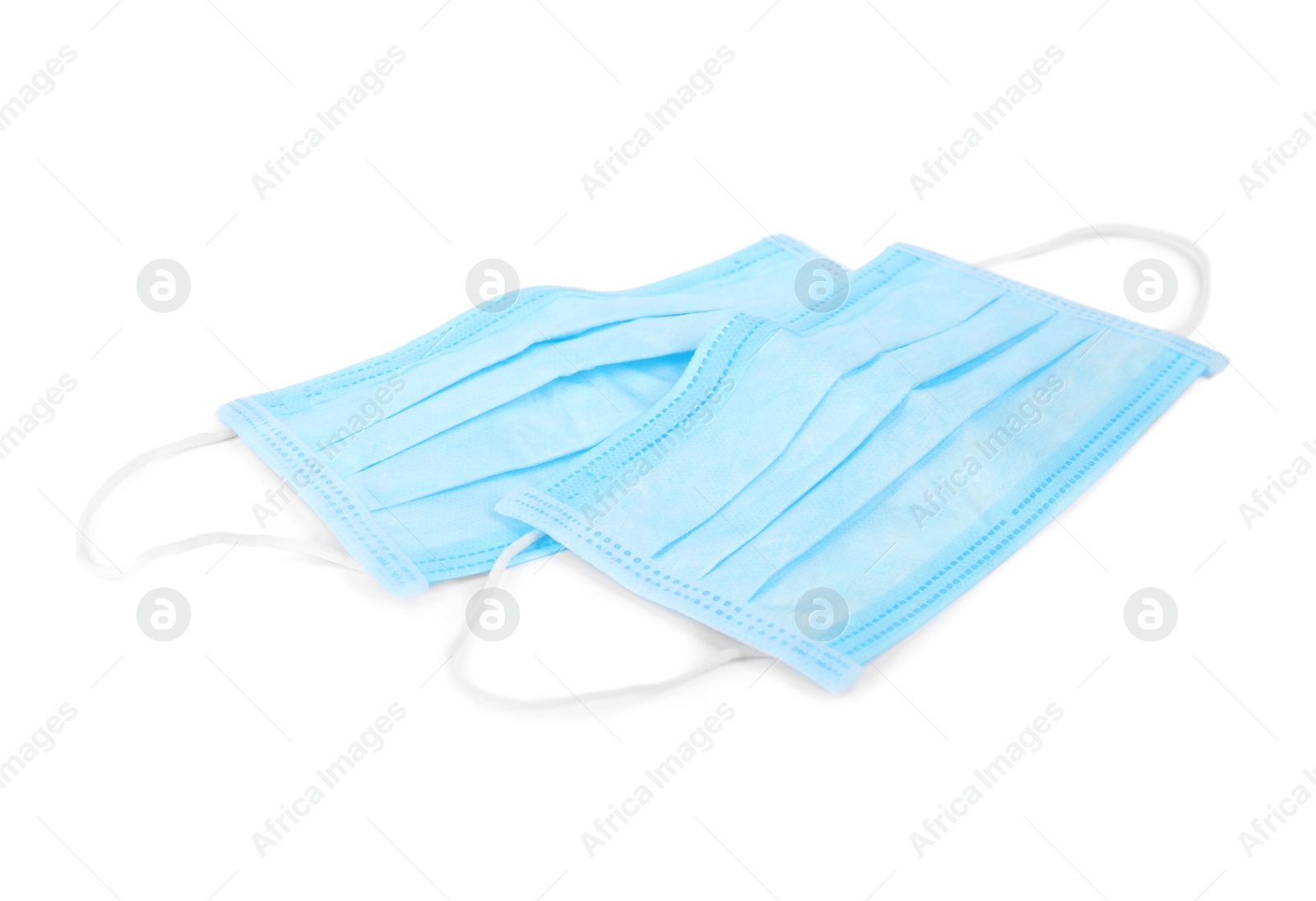 Photo of Blue medical face masks isolated on white