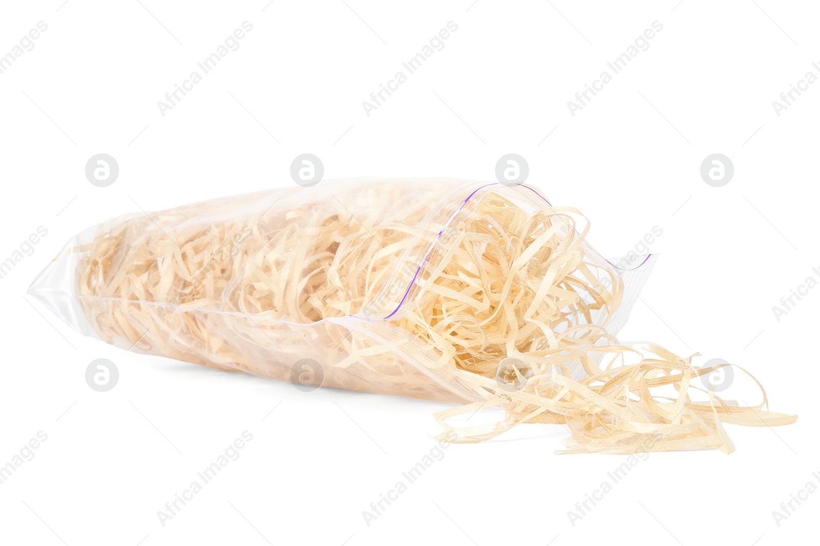 Photo of Wood shavings in zip bag isolated on white