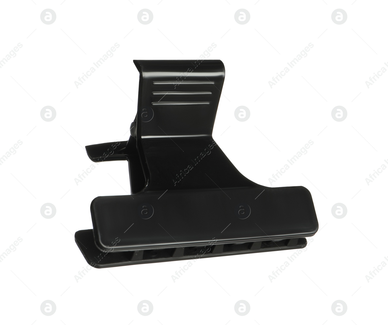 Photo of Hairdresser tool. Black hair clip isolated on white