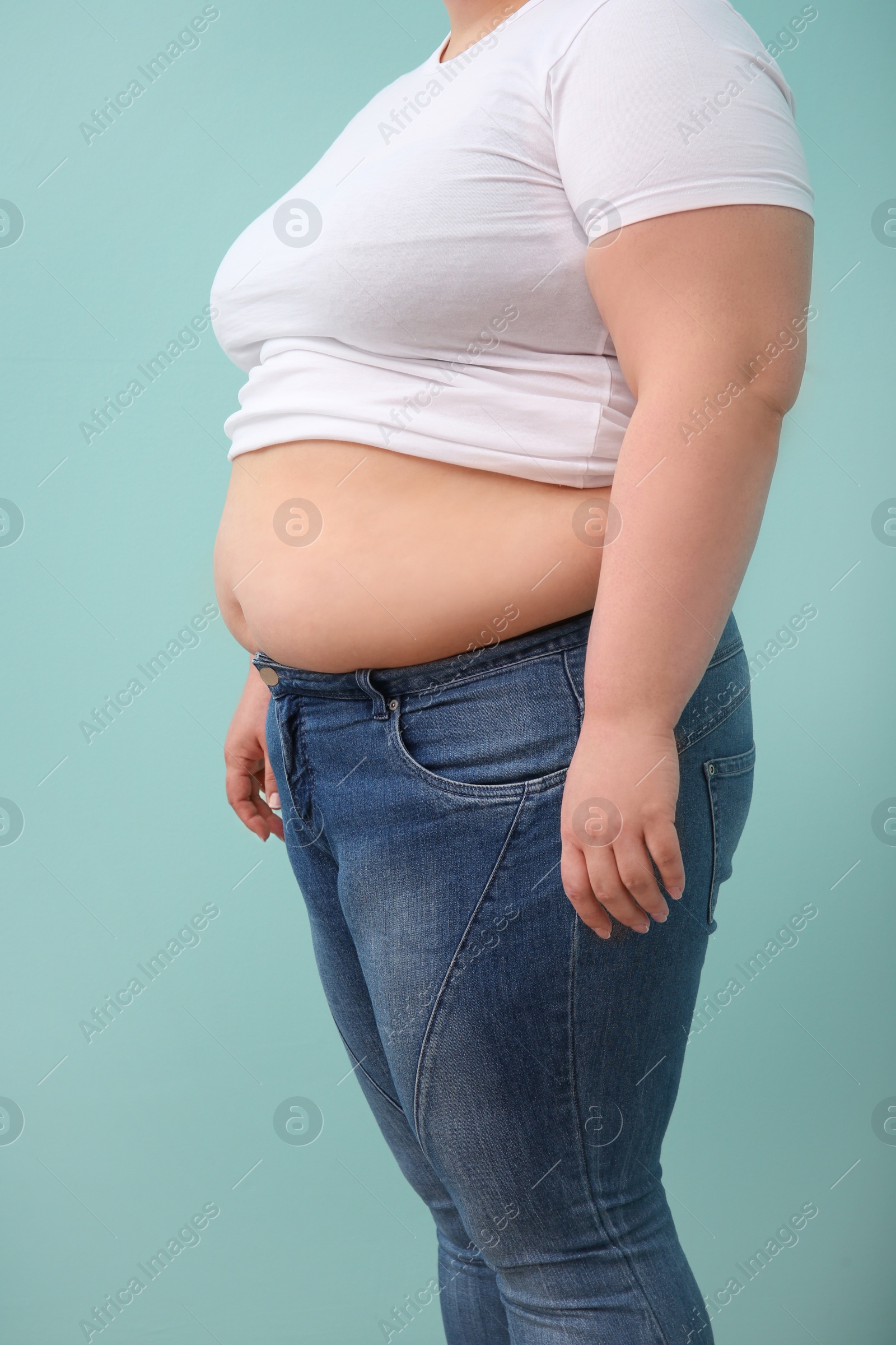 Photo of Overweight woman on color background