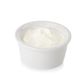 Photo of Bowl with sour cream on white background