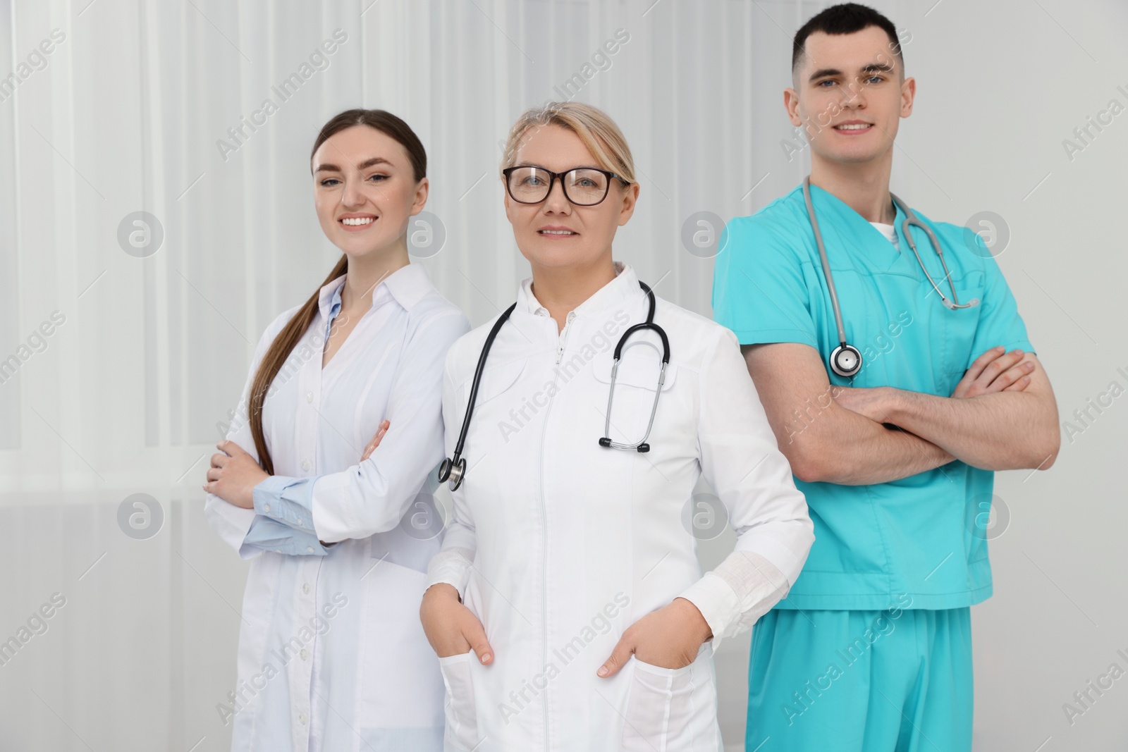 Photo of Portrait of medical doctors wearing uniforms indoors