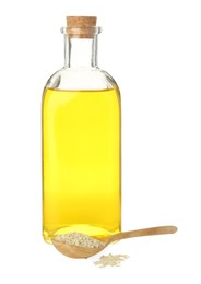 Vegetable fats. Sesame oil in glass bottle and seeds isolated on white