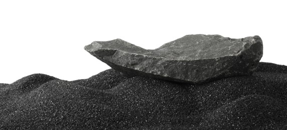 Photo of Presentation of product. Stone podium on black sand against white background