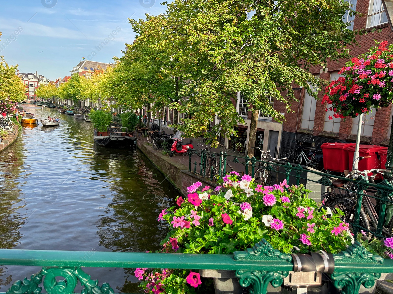 Photo of Beautiful view of city street with buildings and water canal