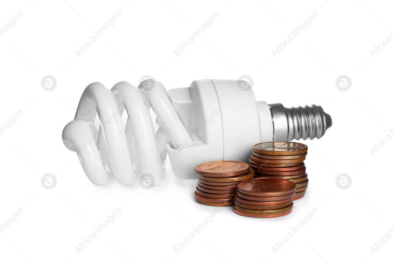 Photo of Lamp bulb and coins on white background. Money saving concept