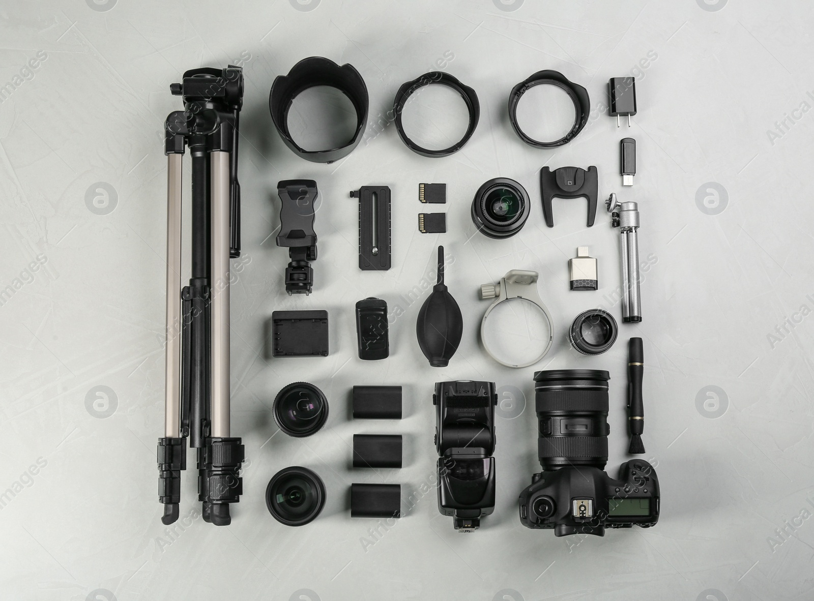 Photo of Flat lay composition with camera and video production equipment on light table