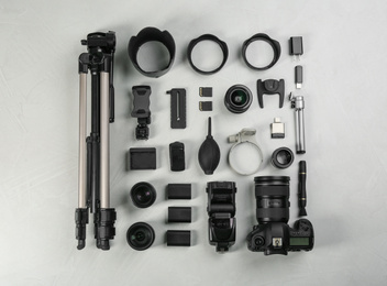 Flat lay composition with camera and video production equipment on light table