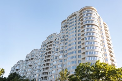 Modern building against blue sky, low angle view