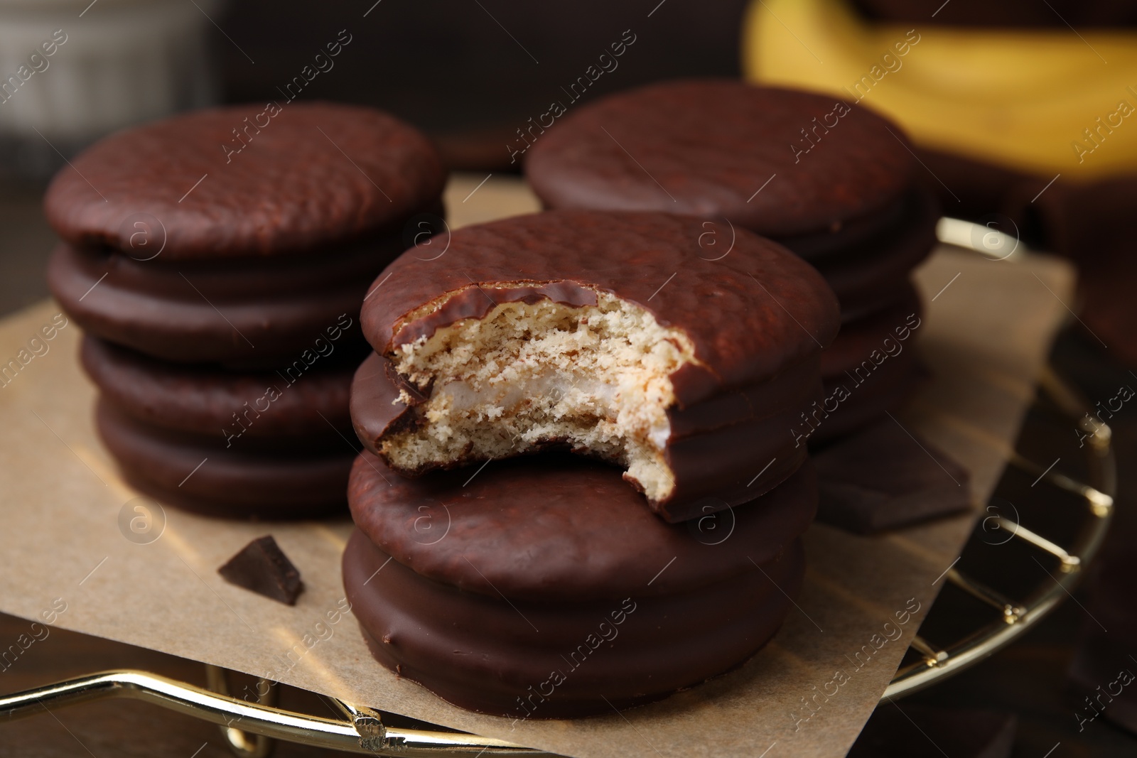 Photo of Delicious banana choco pies on table, closeup