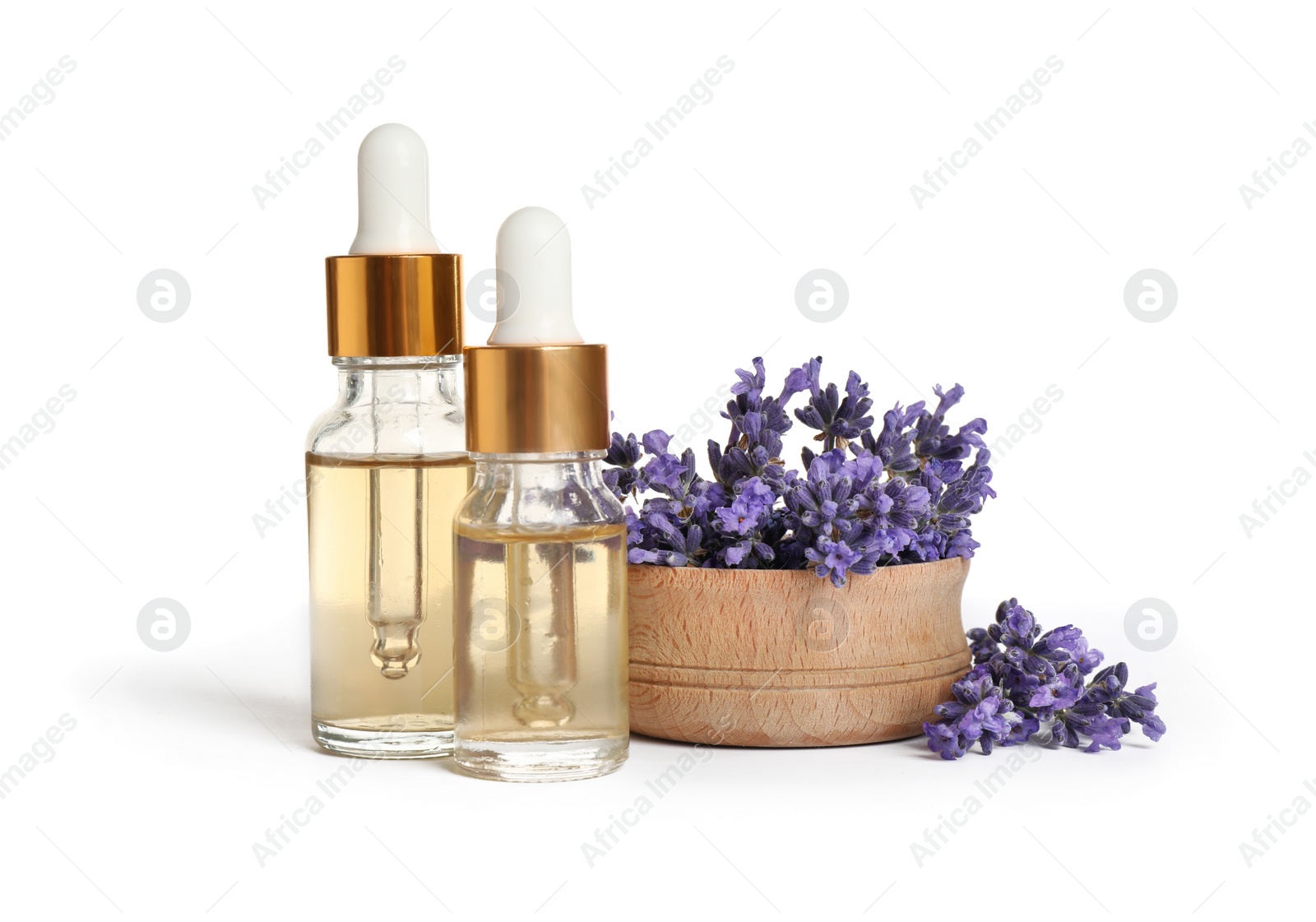 Photo of Bottles of essential oil and lavender flowers on white background