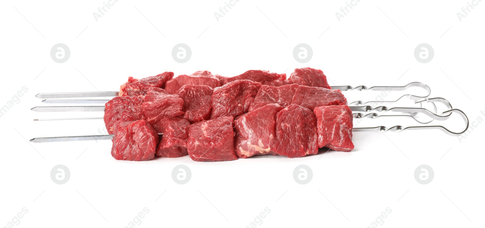 Photo of Metal skewers with raw meat on white background