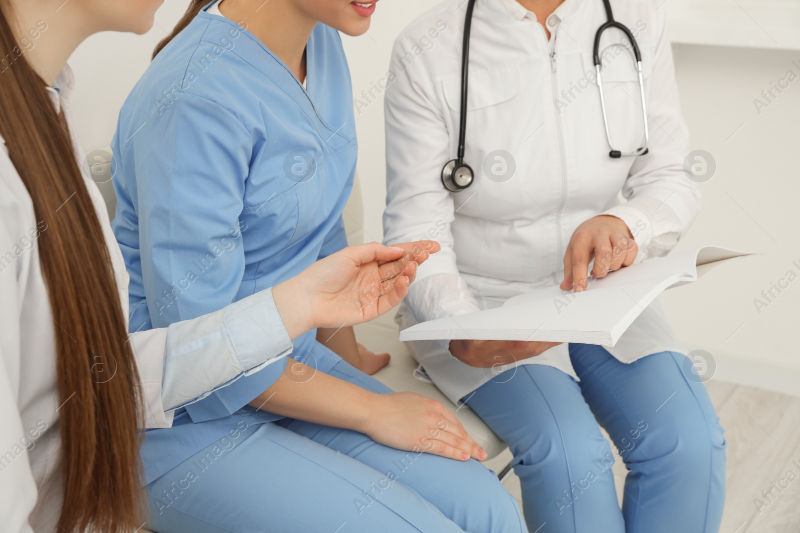 Photo of Team of professional doctors working indoors, closeup