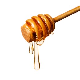 Image of Natural honey dripping from dipper on white background