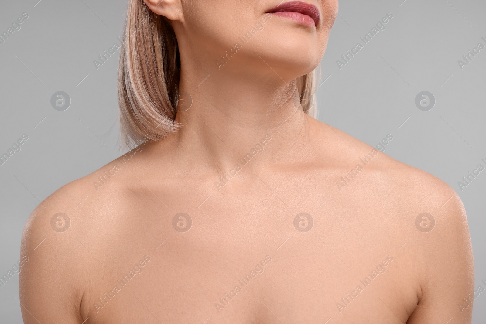 Photo of Woman with healthy skin on grey background, closeup