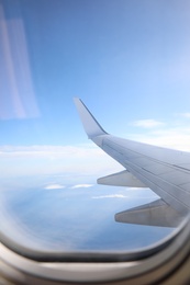 Image of Beautiful view through plane window during flight. Air travel