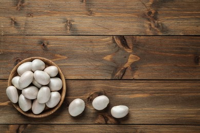 Raw jackfruit seeds on wooden table, flat lay. Space for text