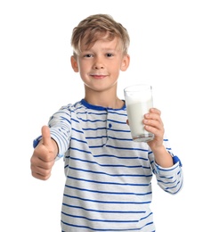 Adorable little boy with glass of milk on white background