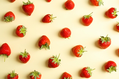 Photo of Flat lay composition with with tasty ripe strawberries on color background