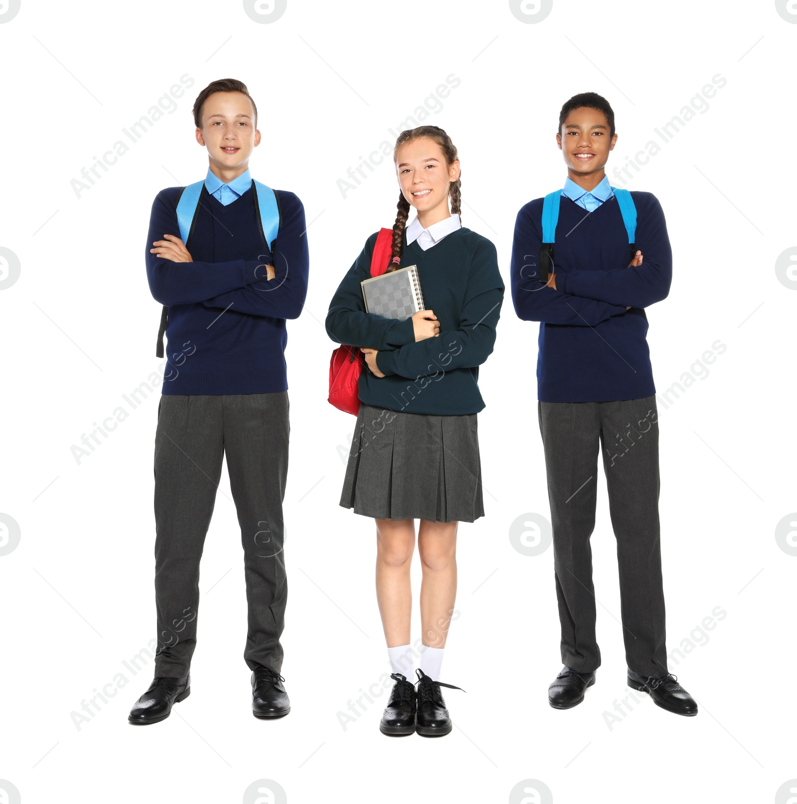 Photo of Teenagers in stylish school uniform on white background