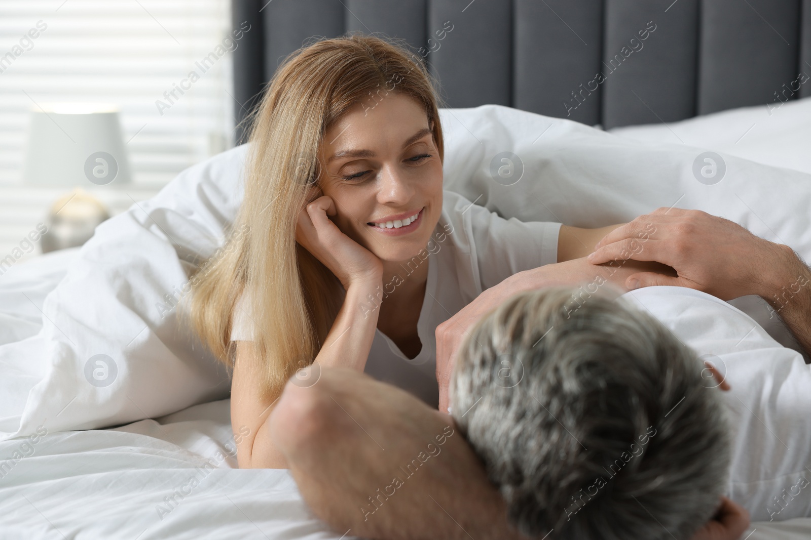 Photo of Lovely mature couple in bed at home